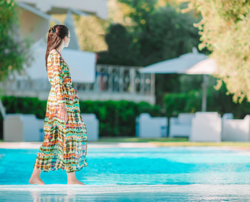 woman-relaxing-hotel-pool-vourvourou