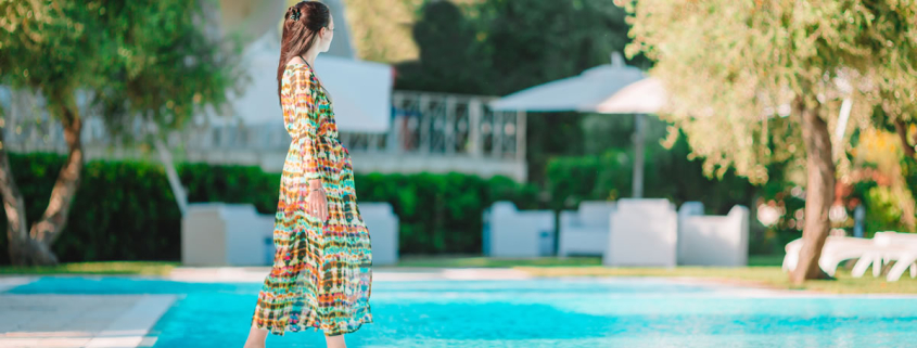 woman-relaxing-hotel-pool-vourvourou